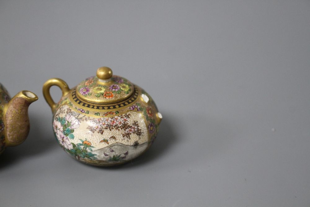 A Satsuma miniature teapot and matching sugar bowl, decorated with geisha in gardens, teapot length 7.5cm height 4.5cm